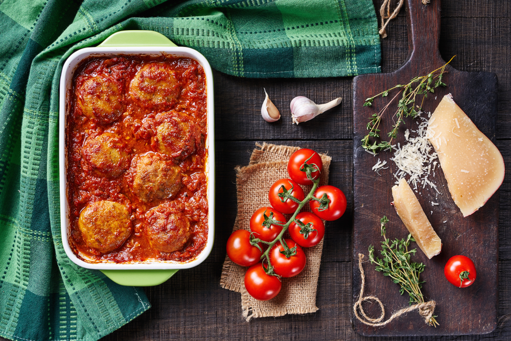 Chicken cutlets of ground meat baked in tomato sauce with herbs and spices