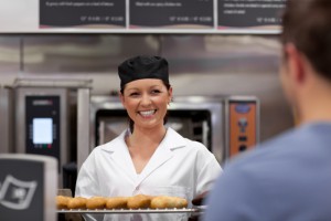 3671433-merry-young-baker-with-baguettes
